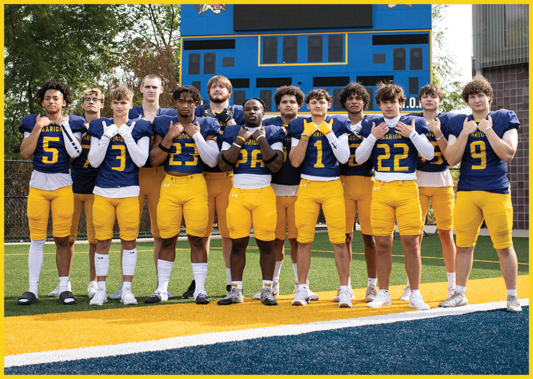 A group of football players pose for a picture in front of a scoreboard. AI generated content