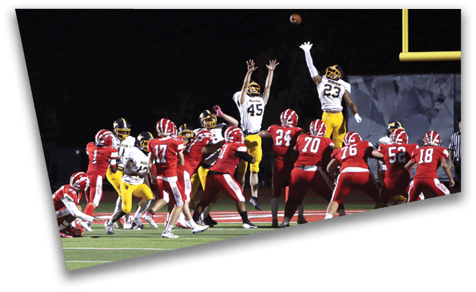 A football player leaps in the air to catch the ball. AI generated content