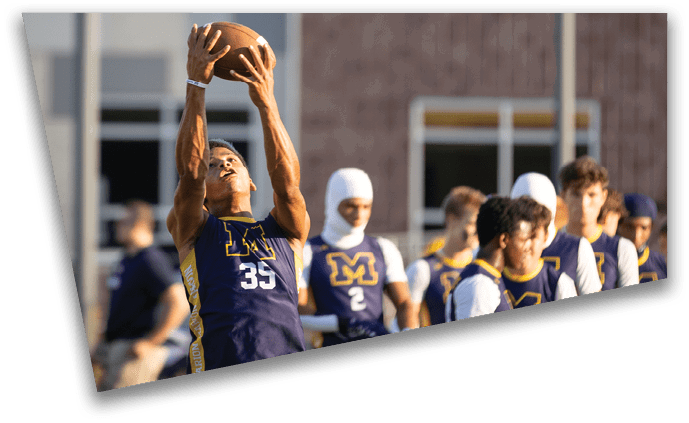A football player in a blue jersey is jumping up to catch a football. AI generated content