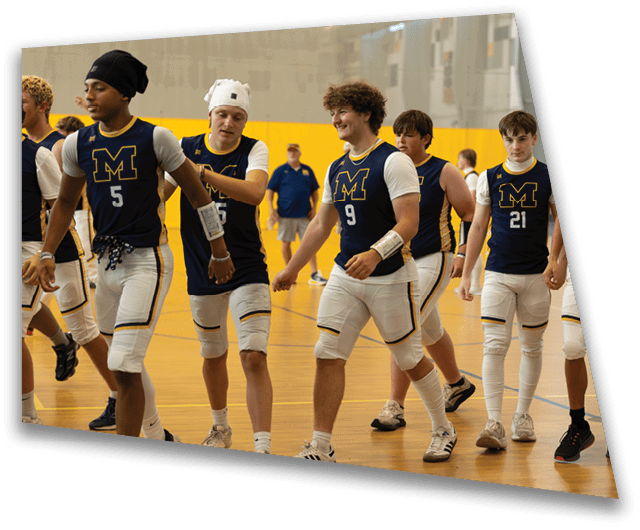 A group of young men wearing blue and white uniforms are walking down a hallway. AI generated content