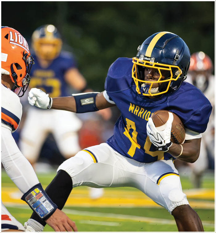 Two football players are on the field, one is trying to tackle the other. AI generated content