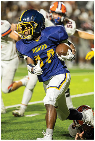 A football player is running with the ball while other players chase him. AI generated content
