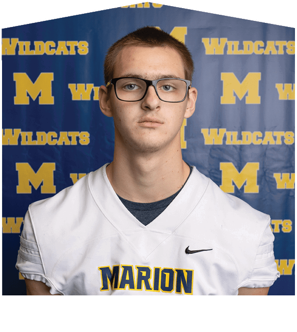 A man wearing glasses and a white jersey with the word “Wildcats" on it. AI generated content