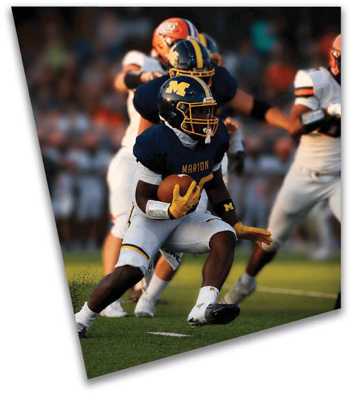 A football player in a blue jersey is running with a football in his hand. AI generated content