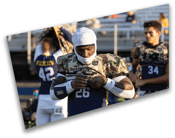 A football player wearing a white and blue uniform is holding a phone. AI generated content