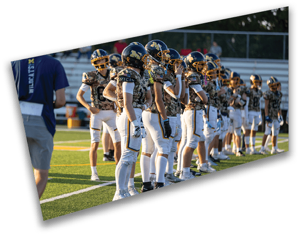 A football team is lined up on the field, wearing camouflage uniforms. AI generated content