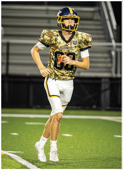 A football player in a blue and yellow uniform is walking on the field. AI generated content