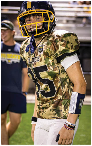 A football player wearing a camouflage jersey with the number 15 on it. AI generated content