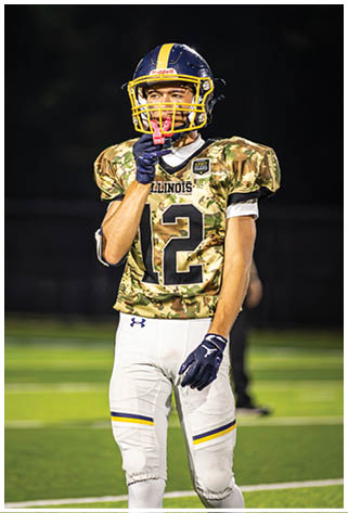 A football player wearing a camouflage jersey with the number 12 on it. AI generated content