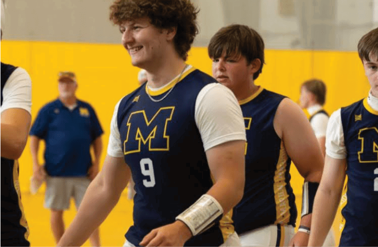 A group of young men wearing blue and white uniforms are walking on a basketball court. AI generated content
