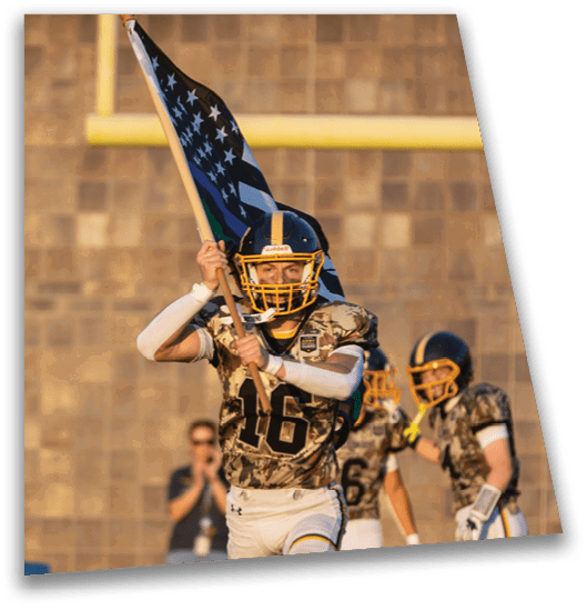 A group of football players are on the field, one of them holding a flag. AI generated content