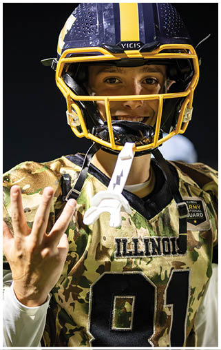 A football player wearing a helmet and uniform with the number 11 on it. AI generated content