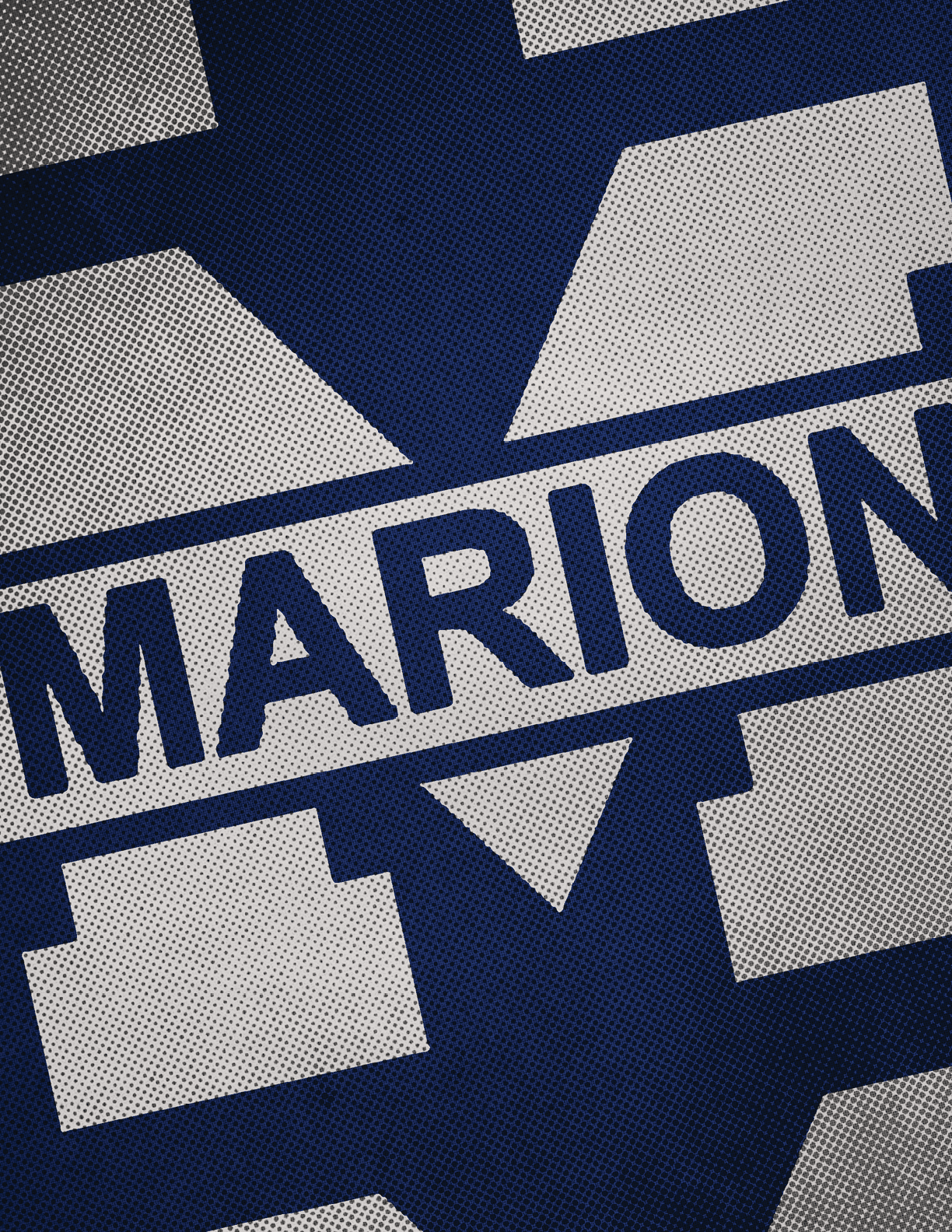 A close-up of a textured fabric with a large blue letter M and the word MARION printed across it in bold blue letters. Description generated by AI