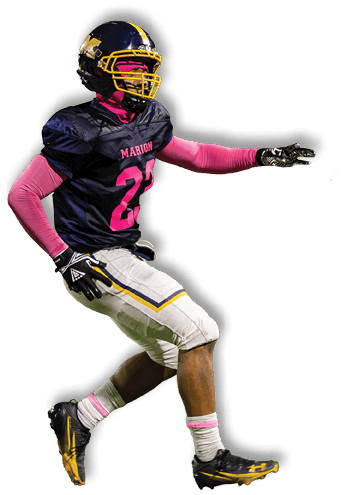 A person wearing a football uniform with a black jersey, white pants, and pink accessories is actively playing on a football field with another player in the background. Description generated by AI