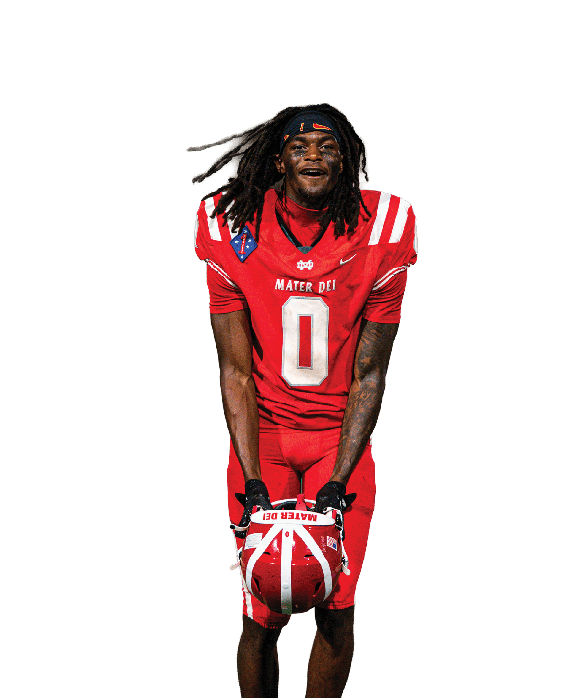 Person wearing a red football uniform with the number zero is standing on a field holding a red and white helmet. Description generated by AI