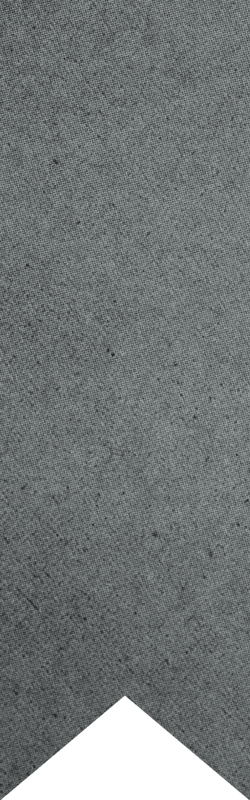 A close-up of a gray textured fabric with a chevron-shaped cutout at the bottom. Description generated by AI