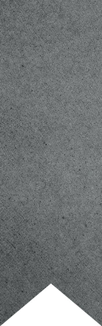 A close-up of a gray textured fabric with a chevron-shaped cutout at the bottom. Description generated by AI