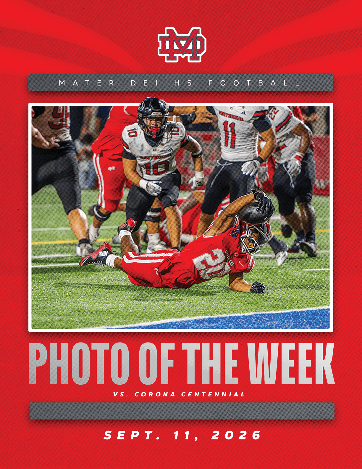 A football player in a red uniform is diving on the field while players in white and black uniforms are nearby during a high school football game. Description generated by AI