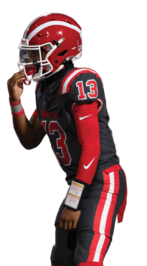 Two people wearing red and black sports uniforms with cleats are standing in athletic poses against a white background. Description generated by AI