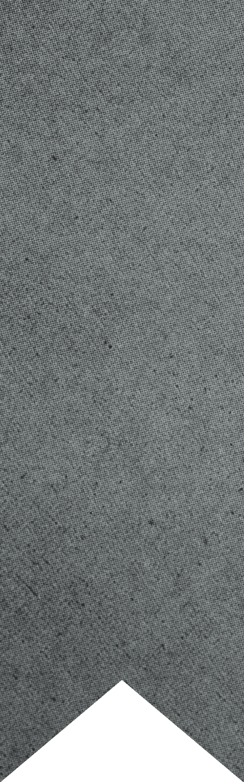 A close-up of a gray textured fabric with a chevron-shaped cutout at the bottom. Description generated by AI
