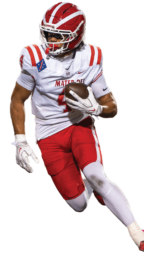 A person wearing a red and white football uniform is running while holding a football. Description generated by AI