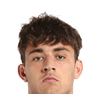 A young man wearing a white jersey with the number 10 on it. Description generated by AI