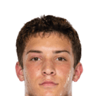 A young man wearing a white jersey with the number 10 on it. Description generated by AI