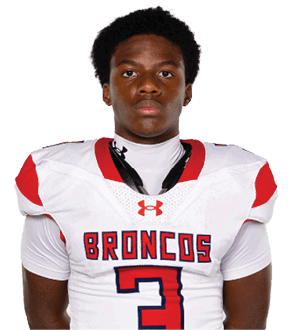 A young man wearing a white jersey with the number 10 on it. Description generated by AI
