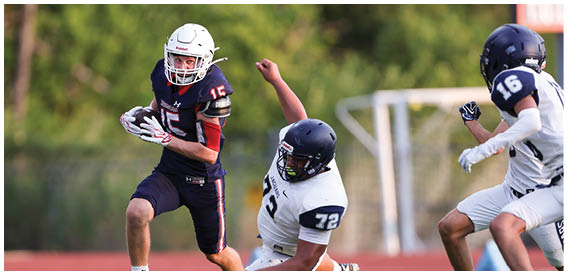 A football player is sliding on the ground. Description generated by AI