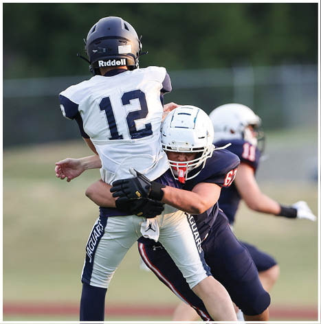 A football player running on the field. Description generated by AI