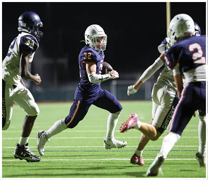 A football player running on the field. Description generated by AI