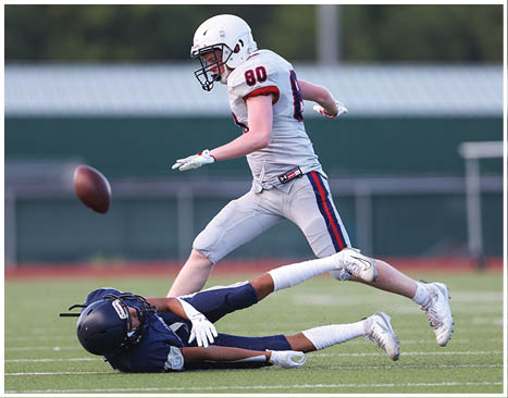 A football player running on the field. Description generated by AI