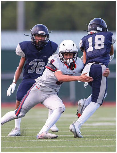 A football player wearing a blue jersey with the number 58 on it. Description generated by AI