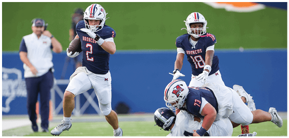 A football player is sliding on the ground. Description generated by AI