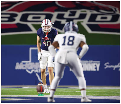 A football player running on the field. Description generated by AI