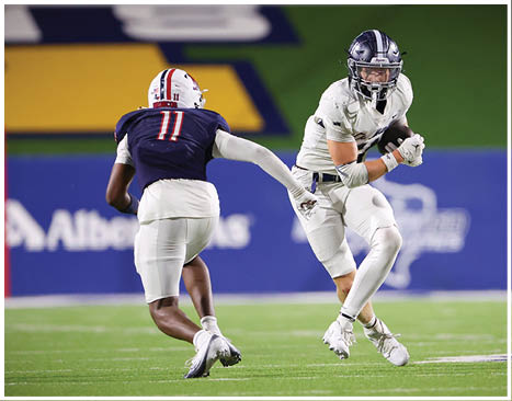 A football player running on the field. Description generated by AI