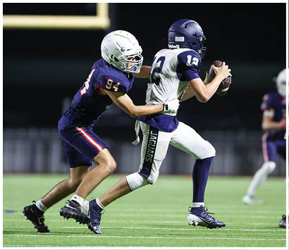 A football player running on the field. Description generated by AI