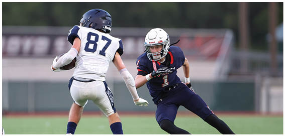 A football player is sliding on the ground. Description generated by AI