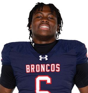 A young man wearing a white jersey with the number 10 on it. Description generated by AI