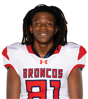 A young man wearing a white jersey with the number 10 on it. Description generated by AI