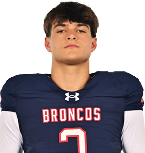 A young man wearing a white jersey with the number 10 on it. Description generated by AI
