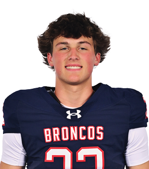A young man wearing a white jersey with the number 10 on it. Description generated by AI