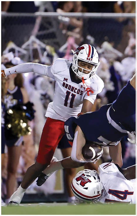 A football player running on the field. Description generated by AI