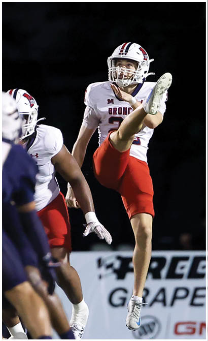A football player running on the field. Description generated by AI