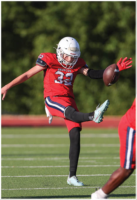 A football player running on the field. Description generated by AI