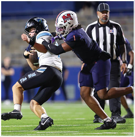 A football player running on the field. Description generated by AI