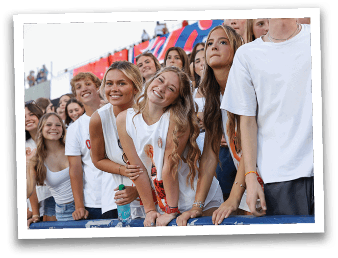 A group of football players on a field. Description generated by AI
