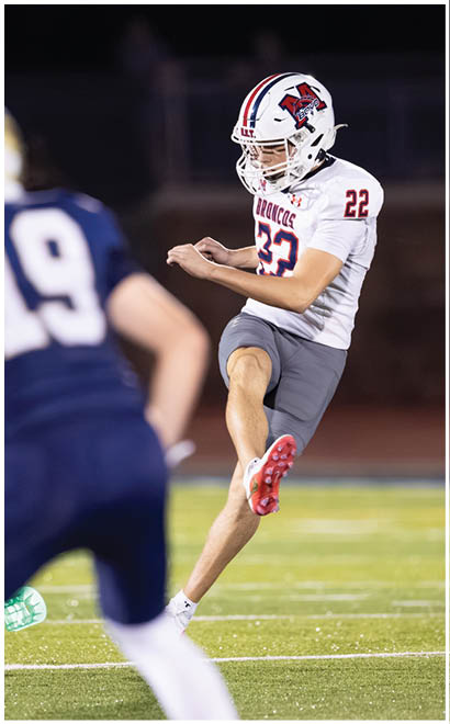 A football player running on the field. Description generated by AI