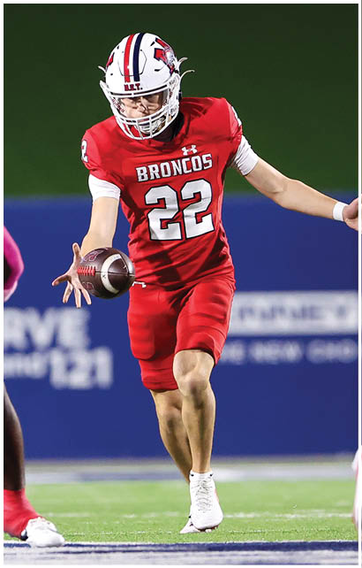 A football player running on the field. Description generated by AI