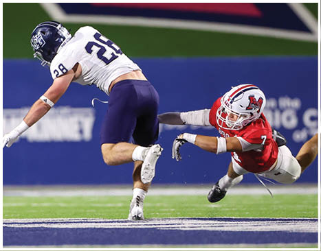 A football player running on the field. Description generated by AI